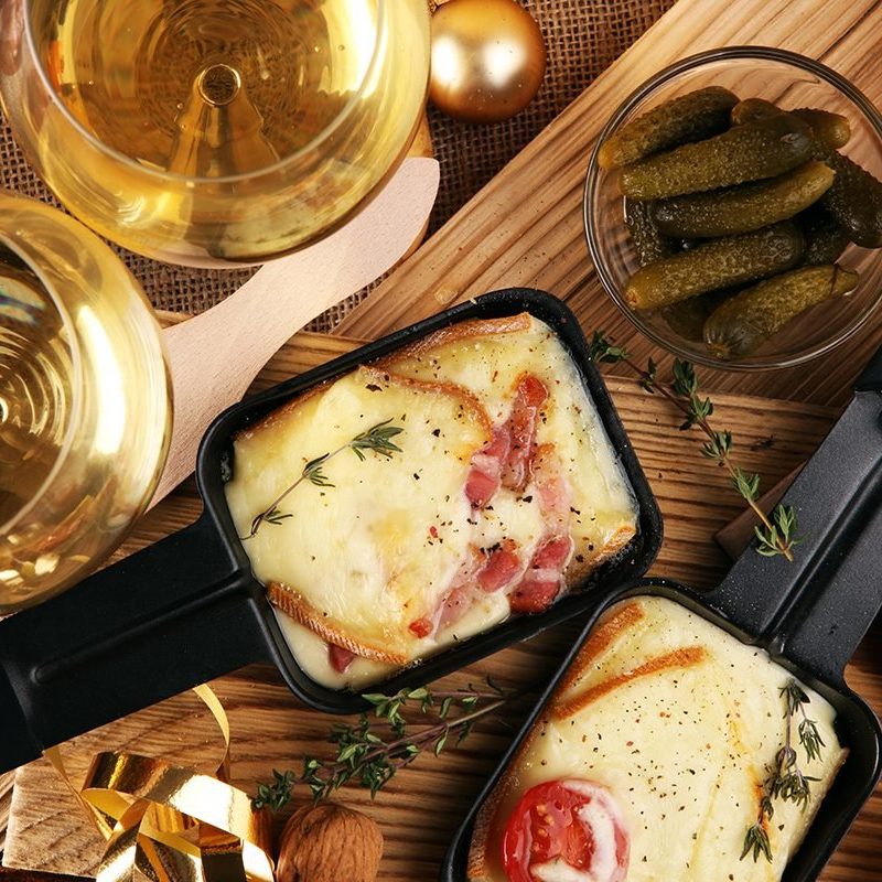 delicious-traditional-swiss-melted-raclette-cheese-shutterstock_767919538-e1707988274109.jpg